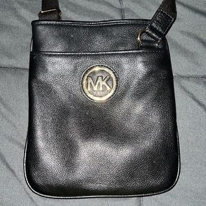 Michael Kors Black leather crossbody. Like new. Gold emblem.